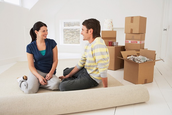 http://www.dreamstime.com/royalty-free-stock-photos-happy-couple-sitting-their-new-home-young-half-rolled-carpet-image31838138
