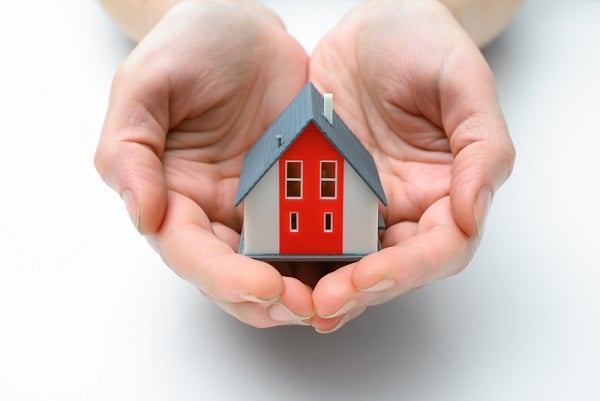 http://www.dreamstime.com/royalty-free-stock-photography-house-human-hands-presenting-small-model-image37534967