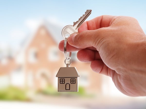 http://www.dreamstime.com/royalty-free-stock-photo-giving-house-keys-holding-shaped-keychain-front-new-home-image42784335