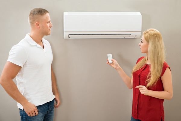 http://www.dreamstime.com/stock-photo-operating-remote-control-air-conditioner-couple-image55844880