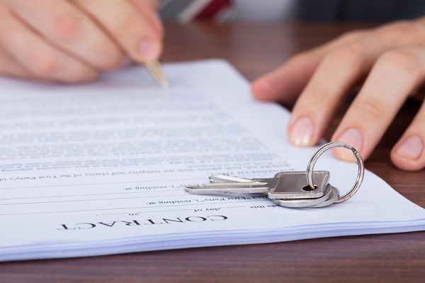 http://www.dreamstime.com/royalty-free-stock-images-man-signing-contract-keys-cropped-image-image43447009